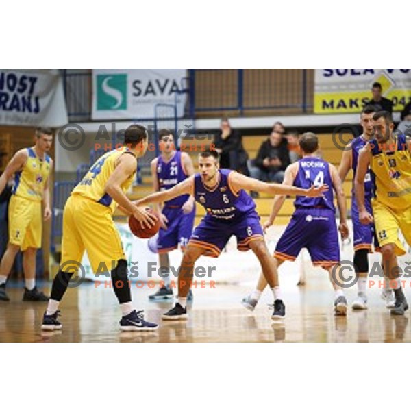 Miljan Pavkovic of Sencur GGD and Matej Rojc in action during Nova KBM league basketball match between Sencur GGD and Helios Suns in Sencur Sports Hall, Slovenia on December 2, 2017