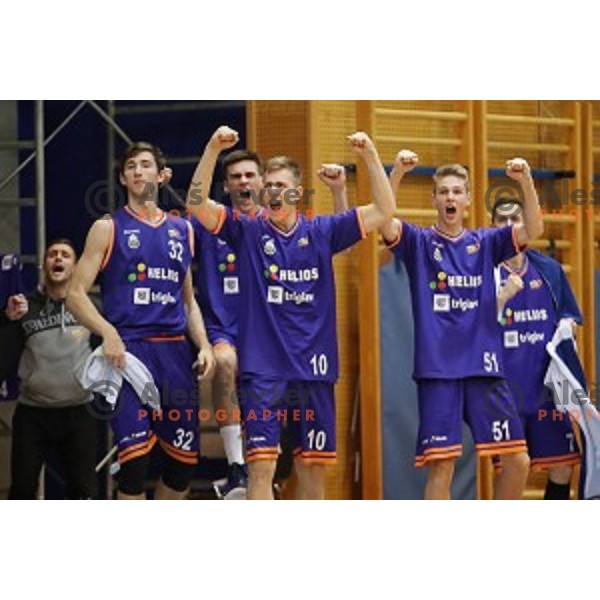 Alexander Shaskov, Urban Oman and Jakob Strel of Helios Suns celebrate during Nova KBM league basketball match between Sencur GGD and Helios Suns in Sencur Sports Hall, Slovenia on December 2, 2017