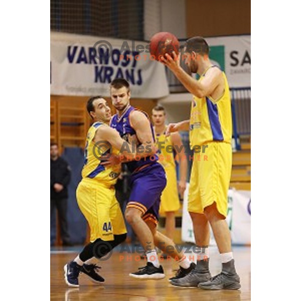 Miljan Pavkovic of Sencur GGD and Matej Rojc in action during Nova KBM league basketball match between Sencur GGD and Helios Suns in Sencur Sports Hall, Slovenia on December 2, 2017