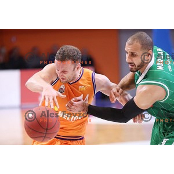 Jure Mocnik of Helios Suns and Jordan Morgan in action during Nova KBM league basketball match between Helios Suns and Petrol Olimpija in Domzale Sports Hall, Slovenia on December 10, 2017