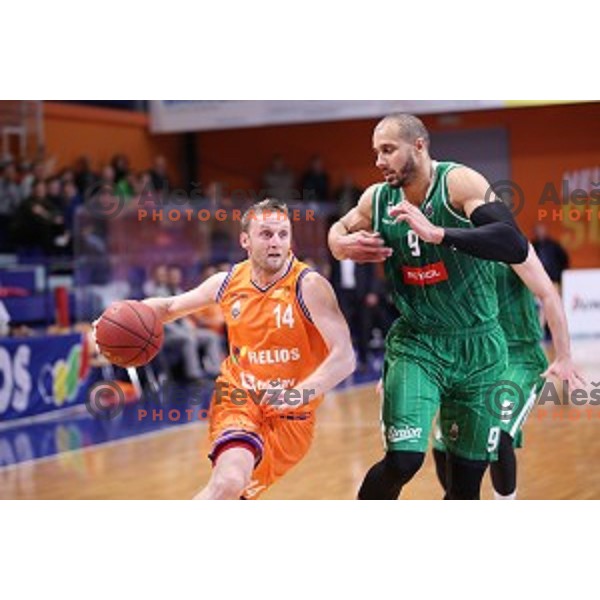 Jure Mocnik of Helios Suns and Jordan Morgan in action during Nova KBM league basketball match between Helios Suns and Petrol Olimpija in Domzale Sports Hall, Slovenia on December 10, 2017