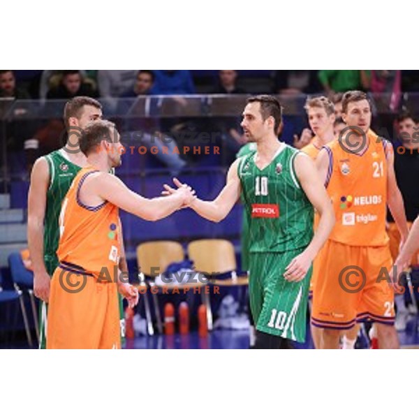 Jure Mocnik of Helios Suns and Domen Lorbek during Nova KBM league basketball match between Helios Suns and Petrol Olimpija in Domzale Sports Hall, Slovenia on December 10, 2017