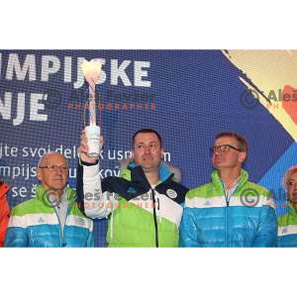 Miro Cerar, Tomaz Razingar, Ivo Carman and Slovenia Olympic team lights up Olympic flame in Ljubljana, Slovenia on January 9, 2018