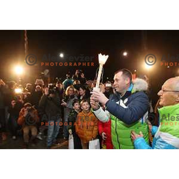 Tomaz Razingar and Slovenia Olympic team lights up Olympic flame in Ljubljana, Slovenia on January 9, 2018
