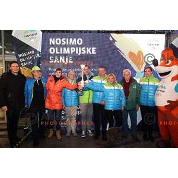 Tomaz Razingar and Slovenia Olympic team lights up Olympic flame in Ljubljana, Slovenia on January 9, 2018