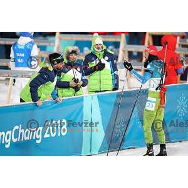 Jakov Fak (SLO) stops near coach Tomas Kos at Men\'s Biathlon 12.5 km Pursuit in Alpensia Biathlon Centre during PyeongChang 2018 Winter Olympic Games, South Korea on February 12, 2018