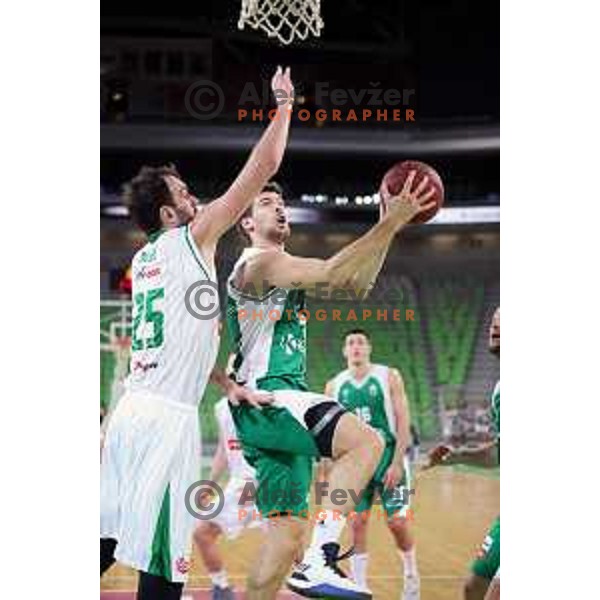 Mirza Begic blocks Paolo Marinelli of Krka during Nova KBM league basketball match between Petrol Olimpija and Krka in Stozice, Ljubljana, Slovenia on March 17, 2018