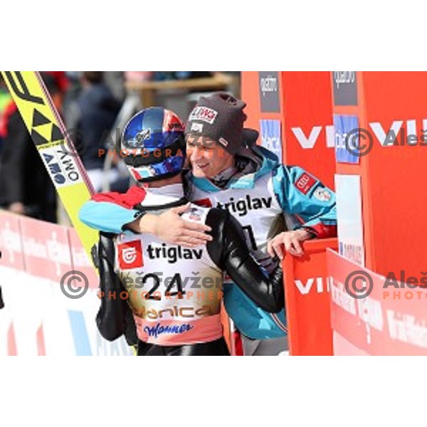 Daniel Hiber congrats Gregor Schlierenzauer (AUT) who jumped 253,5 meters, but touched the ground with hands at Ski flying Qualification during the Final of Ski jumping World Cup 2017/2018 in Planica, Slovenia on March 22, 2018