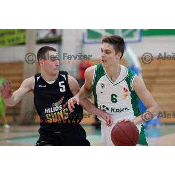 Miha Skedelj of Krka and Urban Tajher of Helios Suns in action during Final of U-19 Boys Championship basketball match between Krka and Helios Suns in Novo mesto, Slovenia on March 25, 2018