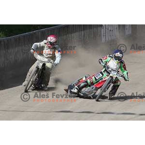 Matic Ivacic (red) and Nick Skorja (blue) race during Speedway second race for National Championship in Ljubljana, Slovenia on April 14, 2018