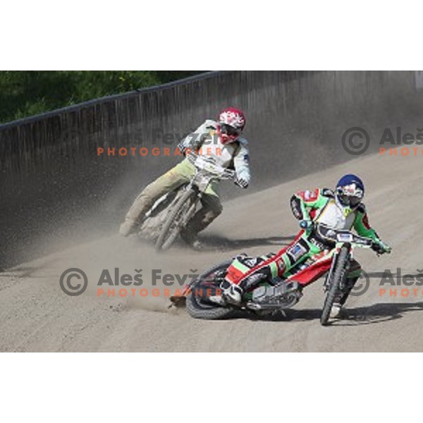 Matic Ivacic (red) and Nick Skorja (blue) race during Speedway second race for National Championship in Ljubljana, Slovenia on April 14, 2018