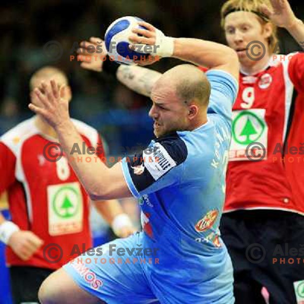 Norway, Stavanger, 23/01/2008. Goran KOZOMARA (3) vs. Börge LUND (9) during European Handball Championship main round match Slovenia Norway.