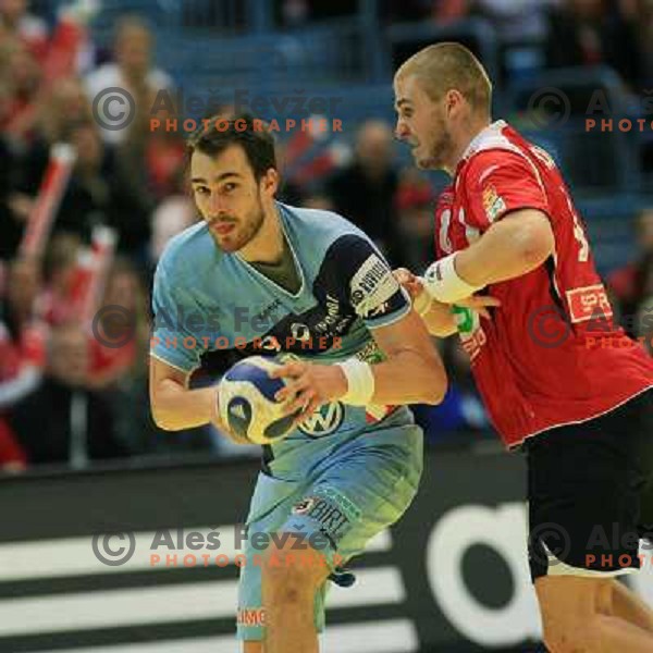 Norway, Stavanger, 23/01/2008. Jure NATEK (9) vs. Bjarthe MYRHOL (8) during European Handball Championship main round match Slovenia Norway. 