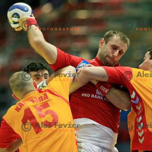 Norway, Stavanger, 24/01/2008. Mateusz JACHLEWSKI (6) vs. Petar KAPISODA (15) during European Handball Championship main round match Poland - Montenegro.