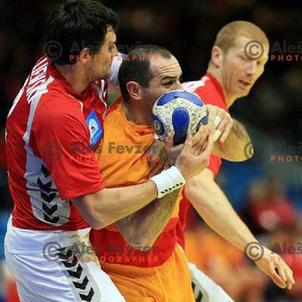 Norway, Stavanger, 24/01/2008. Ratko DJURKOVIC (6) vs. Marcin LIJEWSKI (22) during European Handball Championship main round match Poland - Montenegro.