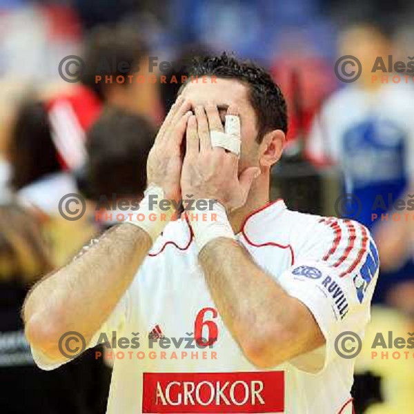 Norway, Lillehammer, 26/01/2008. Blazenko LACKOVIC (6) praying after winning the European Handball Championship semifinal match against France.