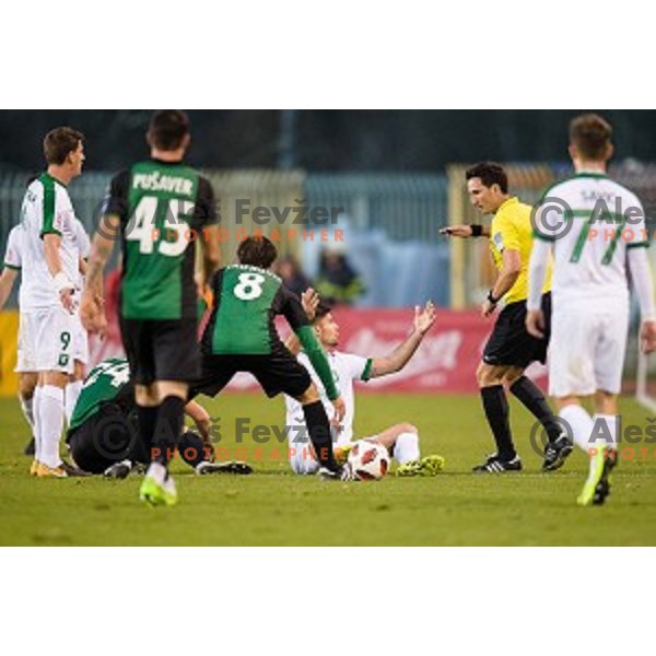 Rok Kronaveter, referee Roman Glazar in action during Prva liga Telekom Slovenije football match between Rudar and Olimpija, Velenje Slovenia on November 11, 2018
