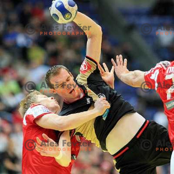 Norway, Lillehammer, 26/01/2008. Lars KAUFMANN (21) vs. Jesper JENSEN (7) during European Handball Championship semifinal match Denmark - Germany.
