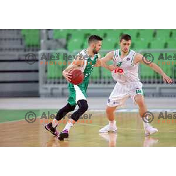 Tim Osolnik and Roko Badzim in action during Nova KBM league basketball match between Petrol Olimpija and Krka in Stozice, Ljubljana, Slovenia on April 5, 201
