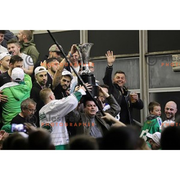 Ales Music, Gal Koren and players of SZ Olimpija celebrate title in Slovenian ice-hockey League after final match between SZ Olimpija and SIJ Acroni Jesenice in Tivoli Hall, Ljubljana, Slovenia on April 25, 2019