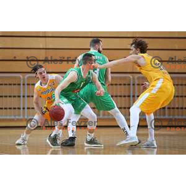 Luka Voncina, Domen Lorbak and Ivan Marinkovic in action during first game of the Final of Nova KBM League basketball match between Sixt Primorska and Petrol Olimpija in Bonifika Arena,Koper, Slovenia on May 18, 2019