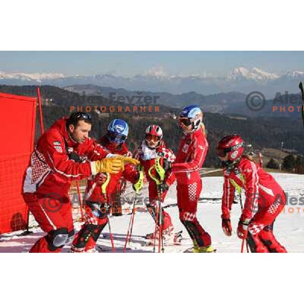 Girls from Croatian team listen to their coach before slalom race for 33. Loka Cup, international children skiing competition in Stari Vrh, Skofja Loka, Slovenia on 16.2.2008 