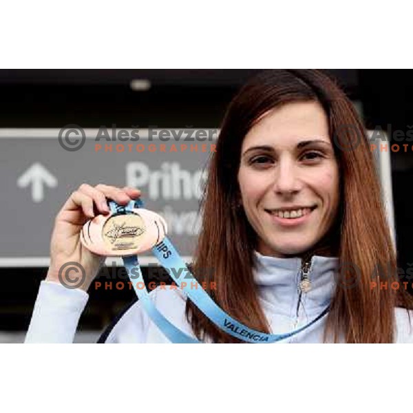 Marija Sestak shows a medal from World Indoor Athletics Championships held in Valencia after she lands back home at Joze Pucnik Airport in Ljubljana 10.3.2008. Photo by Ales Fevzer 