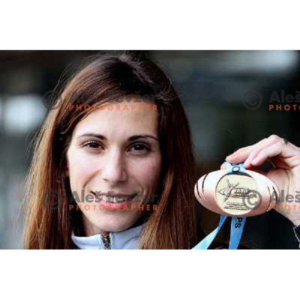 Marija Sestak shows a medal from World Indoor Athletics Championships held in Valencia after she lands back home at Joze Pucnik Airport in Ljubljana 10.3.2008. Photo by Ales Fevzer 