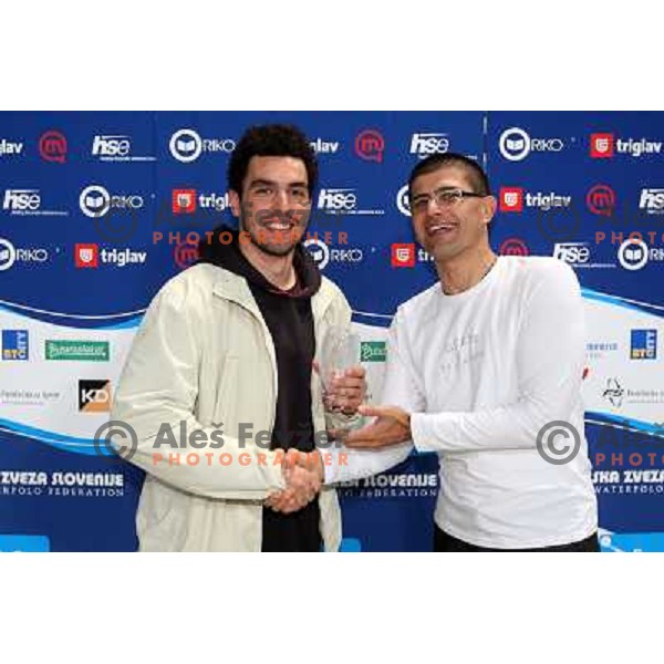 Matjaz Rakovec (left) President of Slovenian Waterpolo federation gives a trophy for third place to captain of Triglav Anzeljc at Alpe Adria league tournament in Kranj 9.3.2008. Photo by Ales Fevzer 