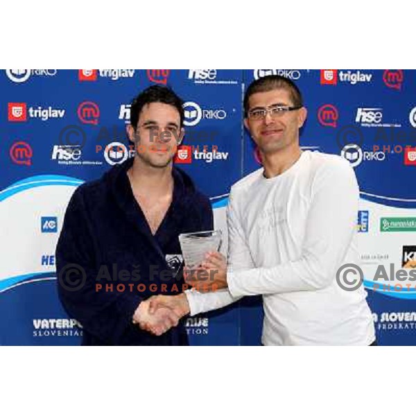 Matjaz Rakovec (left) President of Slovenian Waterpolo federation gives a trophy for best scorer to Danijel Kancijanic (Opatija) at Alpe Adria league tournament in Kranj 9.3.2008. Photo by Ales Fevzer 