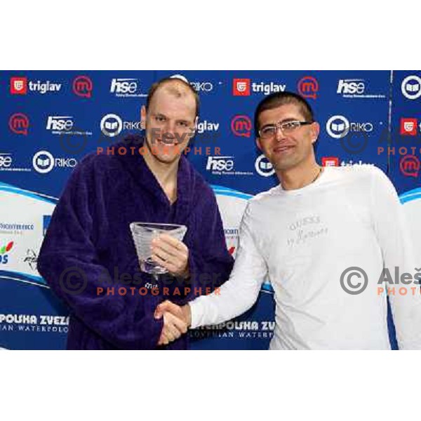 Matjaz Rakovec (left) President of Slovenian Waterpolo federation gives a trophy for best goalkeeper to Balasz Pelle (UTE) at Alpe Adria league tournament in Kranj 9.3.2008. Photo by Ales Fevzer 