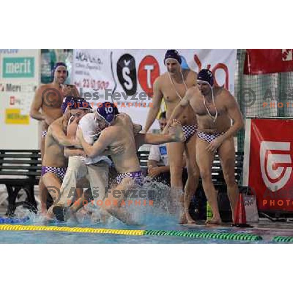 UTE players taking his coach Perovics into the pool after match UTE (Hungary)- Opatija (Croatia) in final of Alpe Adria water polo league tournament in Kranj 9.3.2008. UTE became champion with victory 16:6. Photo by Ales Fevzer 