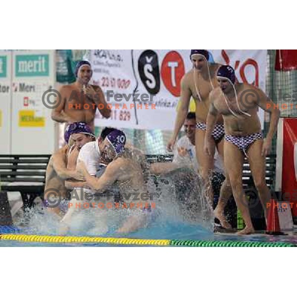 UTE players taking his coach Perovics into the pool after match UTE (Hungary)- Opatija (Croatia) in final of Alpe Adria water polo league tournament in Kranj 9.3.2008. UTE became champion with victory 16:6. Photo by Ales Fevzer 