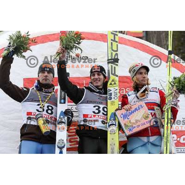 Second placed Janne Ahonen (38), Winner Gregor Schlierenzauer (39) and third placed Bjoern Einar Romoeren in Planica 14.3.2008 