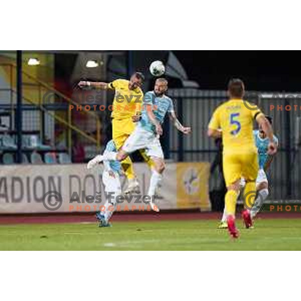 Predrag Sikimic and Alexandru Cretu in action during Prva Liga Telekom Slovenije 2019/2020 football match between Domzale and Maribor in Domzale, Slovenia on June 7 , 2020