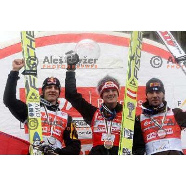 Second placed Gregor Schlierenzauer (AUT), winner Thomas Morgenstern (AUT) and third placed Janne Ahonen (FIN) at prize giving ceremony for overall World Cup Ski jumping in season 2007-2008. Last competiton took place in Planica, Slovenia 16.3.2008. Phot