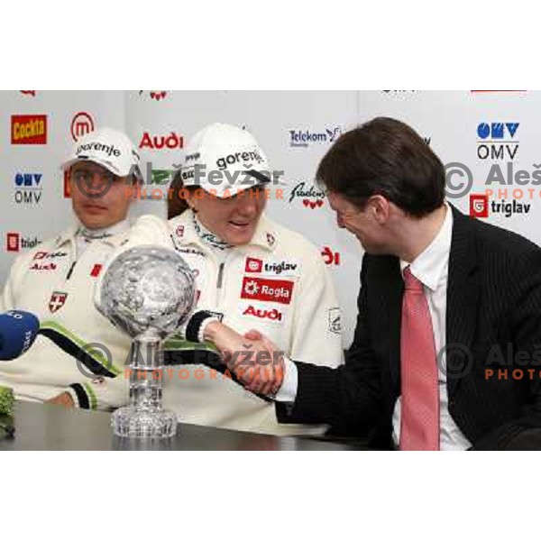 Petra Majdic, winner of FIS Nordic Cross country sprint overall standings for season 2007-2008 shake hands with representative of Uni Credit bank at press conference in Ljubljana, Slovenia 17.3.2008. 