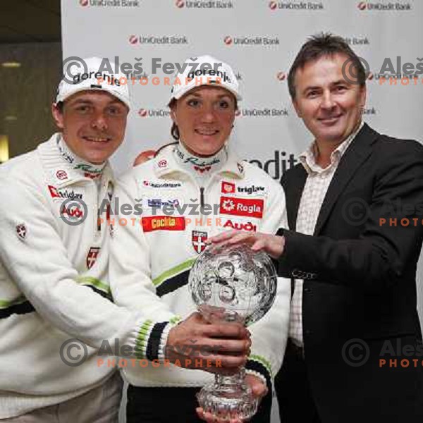 Ivan Hudac (left), Primoz Ulaga (right) and Petra Majdic, winner of FIS Nordic Cross country sprint overall standings for season 2007-2008 pose with the award at press conference in Ljubljana, Slovenia 17.3.2008. 