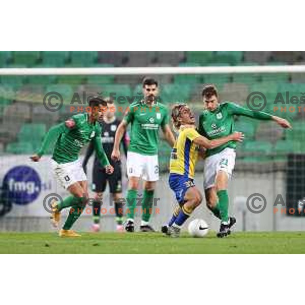Claudio Spinelli and Luka Marin in action during Prva Liga Telekom Slovenije 2002-2021 football match between Olimpija and Koper in SRC Stozice, Ljubljana, Slovenia on November 7, 2020