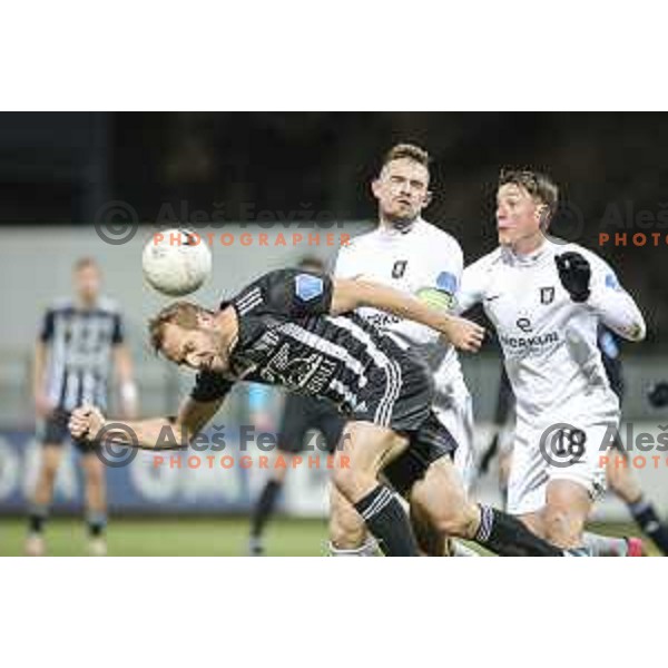 Jure Travner vs Andres Vombergar in action during Prva liga Telekom Slovenije football match between Mura and Olimpija in Fazanerija, Murska Sobota, Slovenia on November 21, 2020