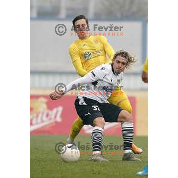 Andraz Zinic and Claudio Spinelli in action during Prva Liga Telekom Slovenije 2020-2021 football match between Domzale and Koper in Domzale on December 5, 2020