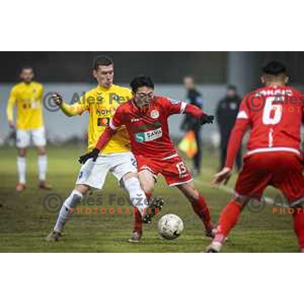 Rok Maher vs Kim Dohyun in action during Prva liga Telekom Slovenije football match between Aluminij and Bravo in Kidricevo, Slovenia on December 12, 2020