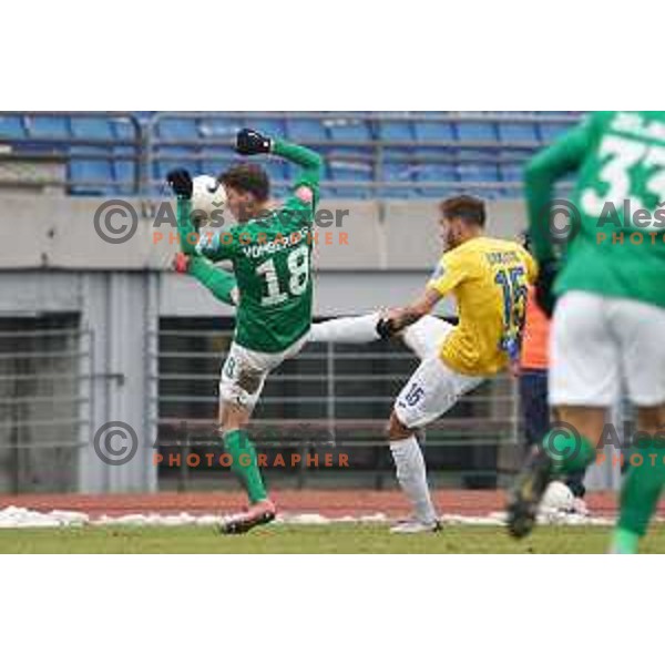 Andres Vombergar and Vanja Drkusic in action during Prva Liga Telekom Slovenije 2020-2021 football match between Bravo and Olimpija in Ljubljana, Slovenia on December 15, 2020