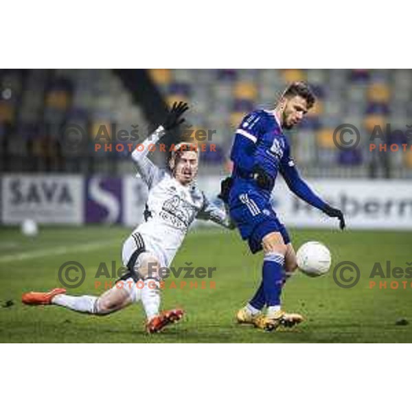 Zan Karnicnik vs Jan Mlakar in action during Prva liga Telekom Slovenije football match between Maribor and Mura in Ljudski vrt, Maribor, Slovenia on December 17, 2020