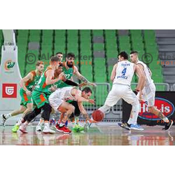 Luka Rupnik, Rion Brown, Ziga Dimec of Cedevita Olimpija and Nikola Ivanovic in action during 7days EuroCup basketball match between Cedevita Olimpija (SLO) and Buducnost VOLI (MNE) in SRC Stozice, Ljubljana on January 19, 2021