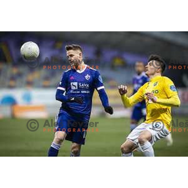 Rudi Vancas Pozeg vs Martin Kramaric in action during Prva liga Telekom Slovenije football match between Maribor and Bravo in Ljudski vrt, Maribor, Slovenia on February 13, 2021