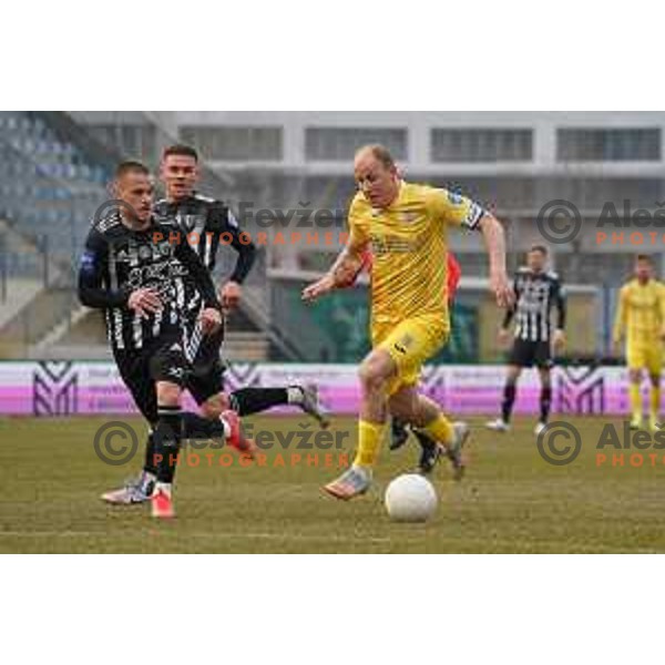 Tomi Horvat and Senijad Ibrcic in action during Prva Liga Telekom Slovenije 2020-2021 football match between Domzale and Mura in Domzale, Slovenia on March 10, 2021