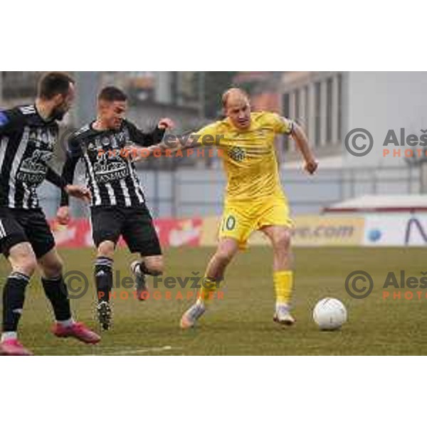 Tomi Horvat and Senijad Ibrcic in action during Prva Liga Telekom Slovenije 2020-2021 football match between Domzale and Mura in Domzale, Slovenia on March 10, 2021