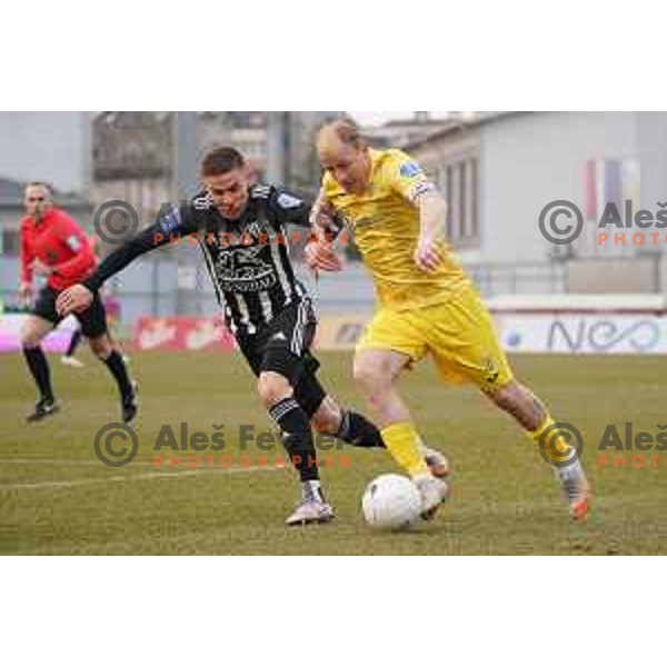 Tomi Horvat and Senijad Ibrcic in action during Prva Liga Telekom Slovenije 2020-2021 football match between Domzale and Mura in Domzale, Slovenia on March 10, 2021