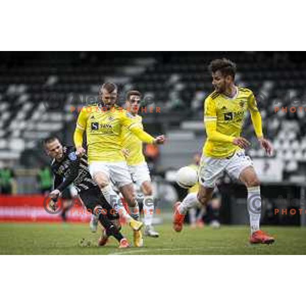 Tomi Horvat and Alexandru Cretu in action during Prva liga Telekom Slovenije football match between Mura and Maribor in Fazanerija, Murska Sobota, Slovenia on March 14, 2021